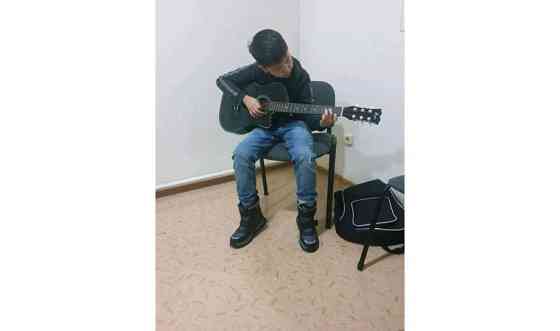 обучение игры на гитаре     
      Астана, улица Маскеу, 18 Нур-Султан