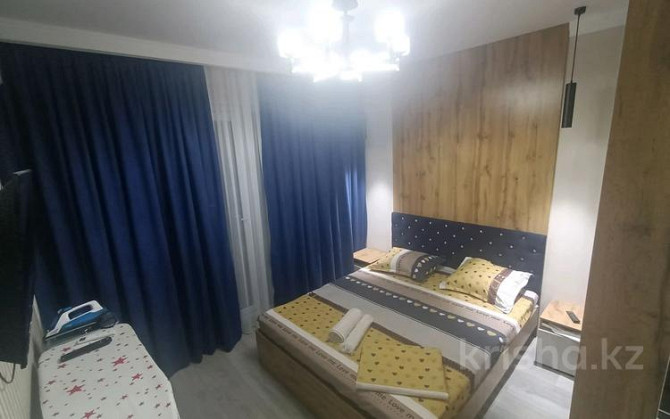 1-комнатная квартира посуточно, 50 м², 6/9 этаж, мкр Нурсат 2 29/4 / Шаяхметова Арғынбекова Shymkent - photo 2