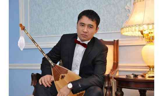 Домбрист-певец в Астане     
      Астана Астана